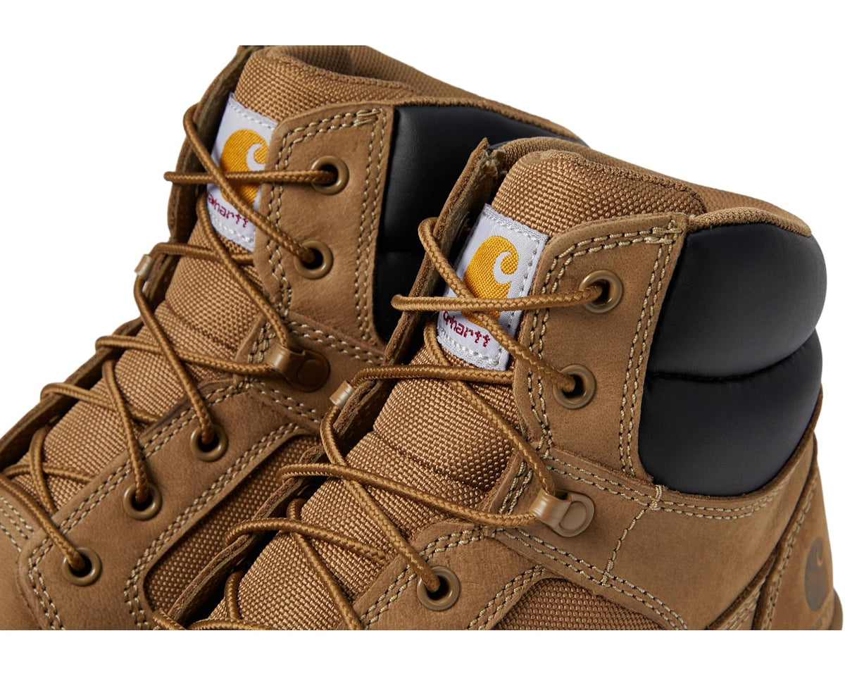 Close-up of coyote nubuck lace-up boot with black padded collar and textured paneling