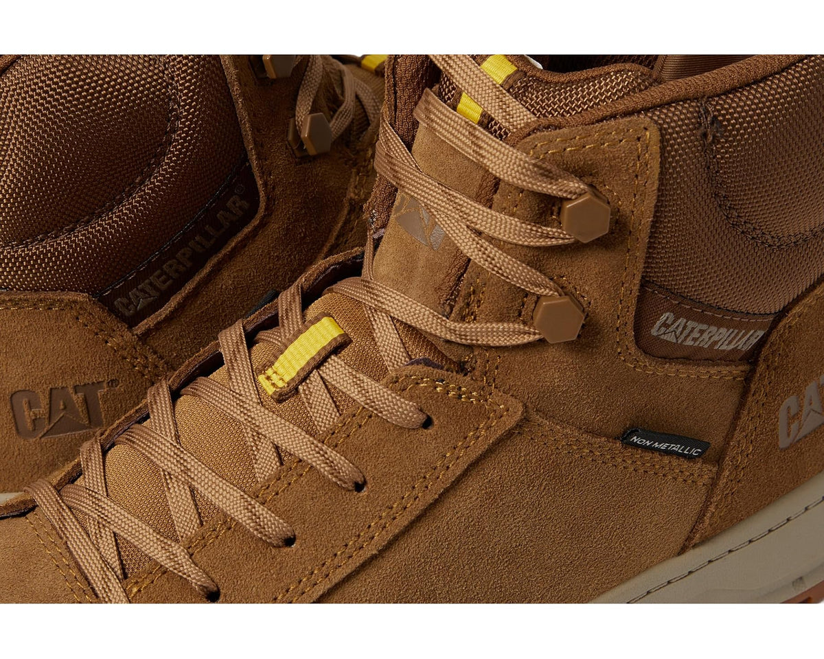 Men's Caterpillar suede sneaker detail: laces, branding patches, and side panel