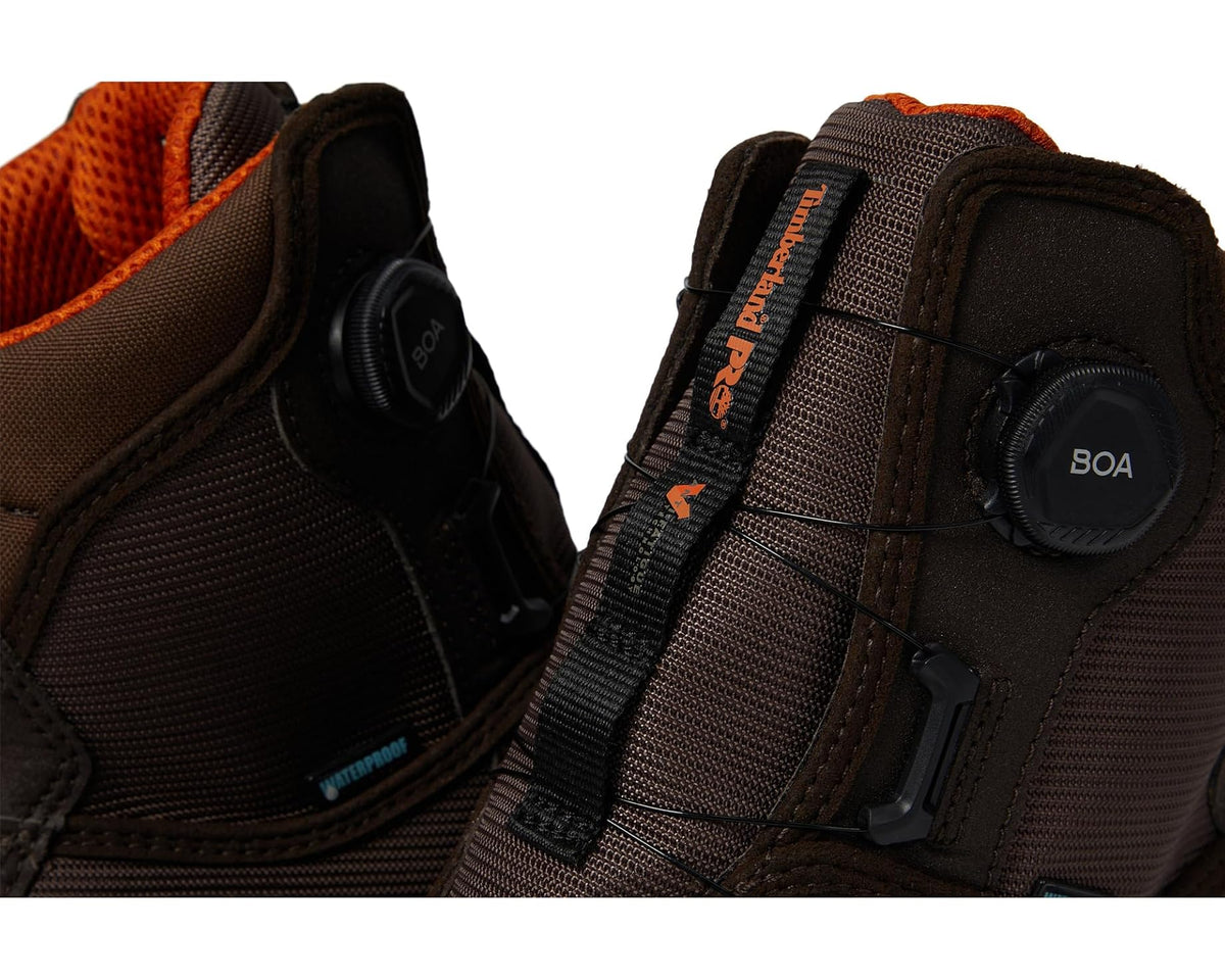 Close-up of brown safety boot BOA dial and mesh lacing panel
