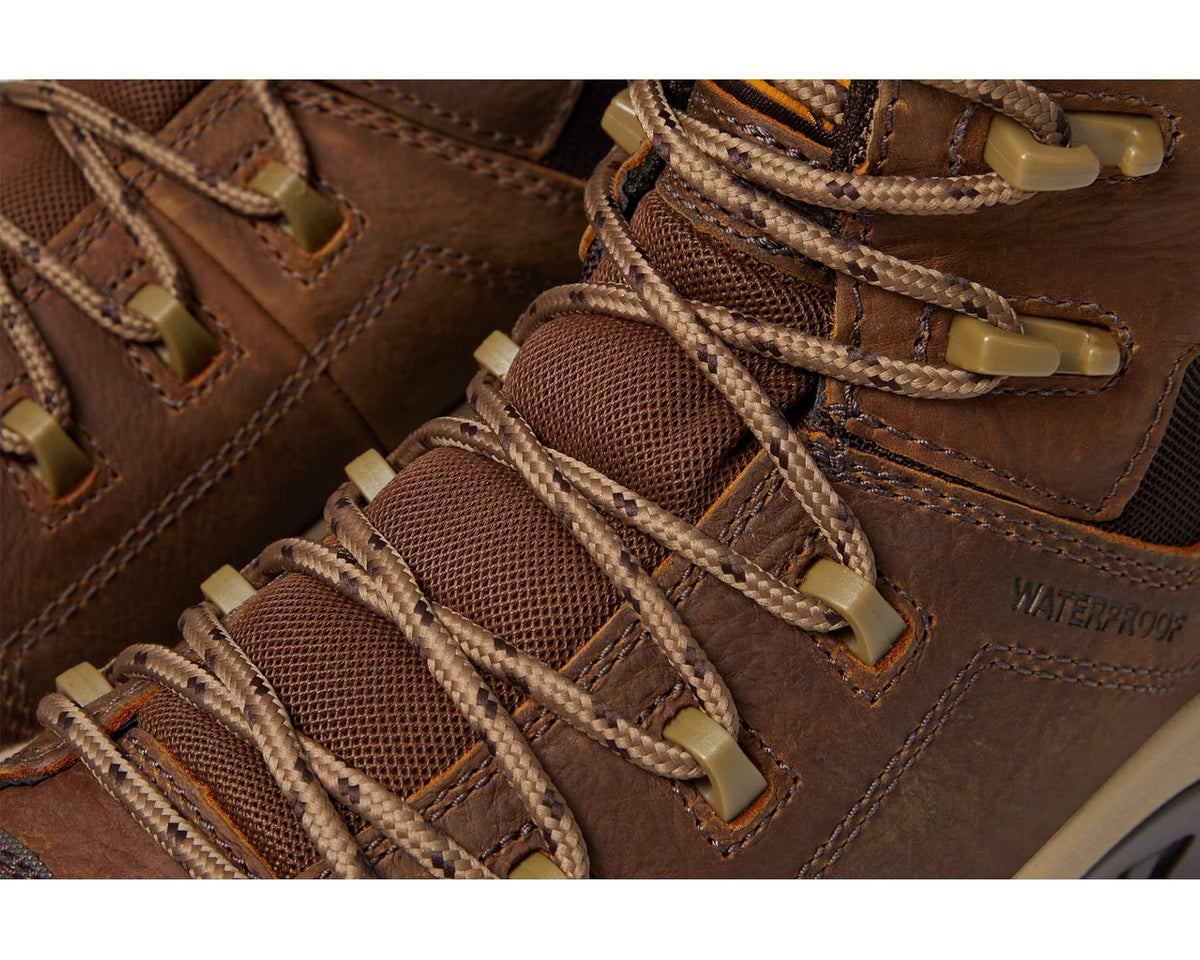 Brown hiker boot laces close-up with waterproof label on upper