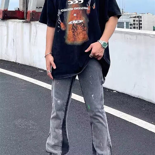 Gray washed denim jeans with light paint splatter, straight relaxed fit