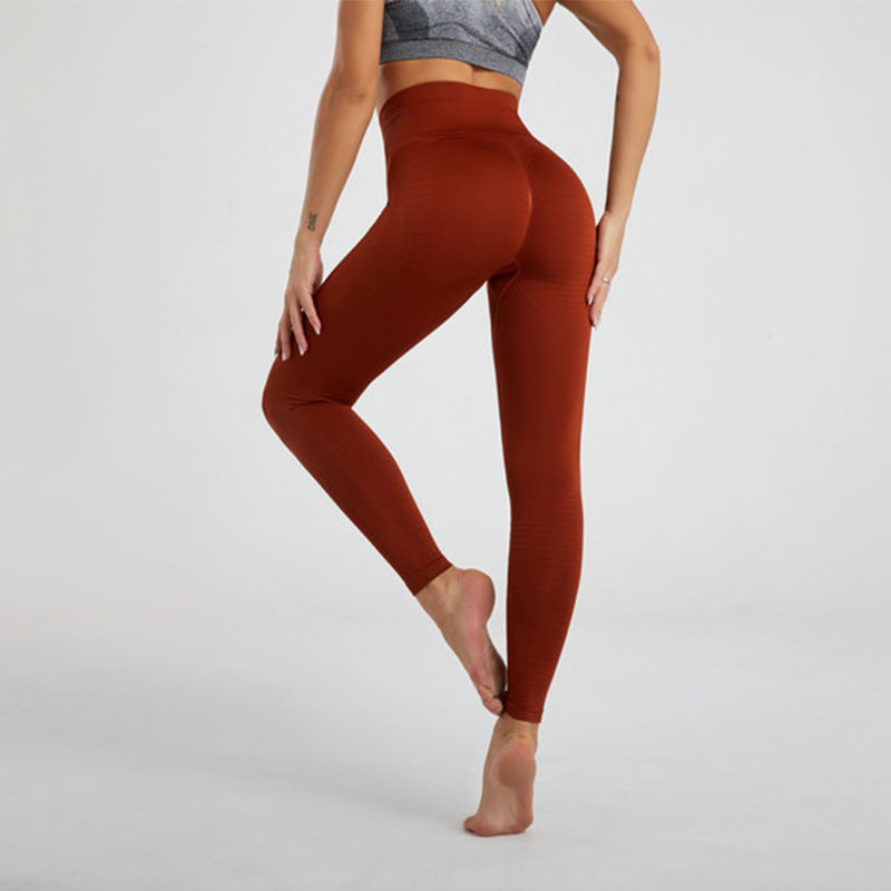 Women’s high-waist rust-brown fitness leggings with textured fabric, full length