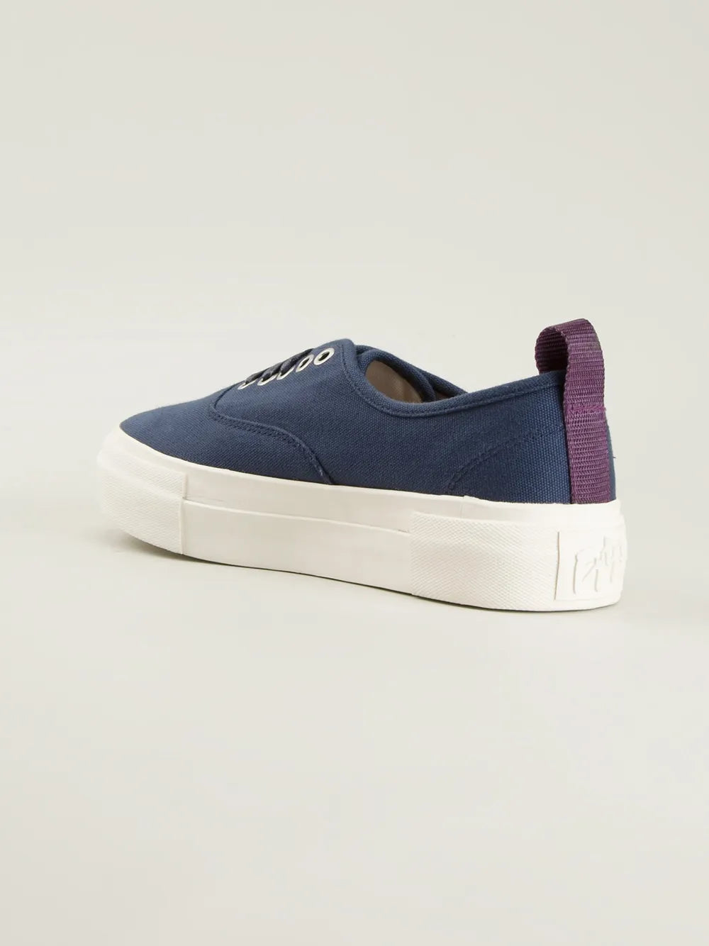 Blue canvas low-top trainers with purple heel tab and white rubber sole