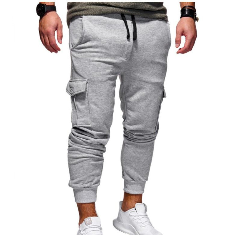 Men’s cargo sweatpants in light gray, drawstring waistband, cargo side pockets, cuffed legs.