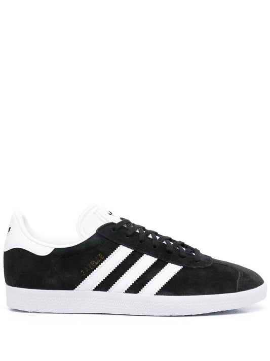 Black adidas Gazelle suede sneaker with white three-stripe side and black laces