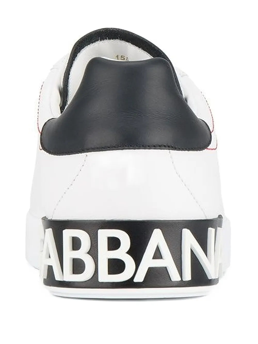 White sneakers with black heel and large "GABBANA" logo on the back