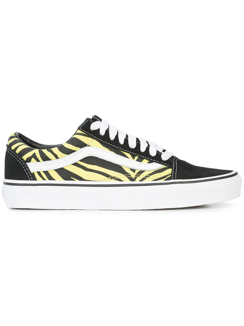 Black low-top skate shoes with yellow zebra stripe canvas and white laces