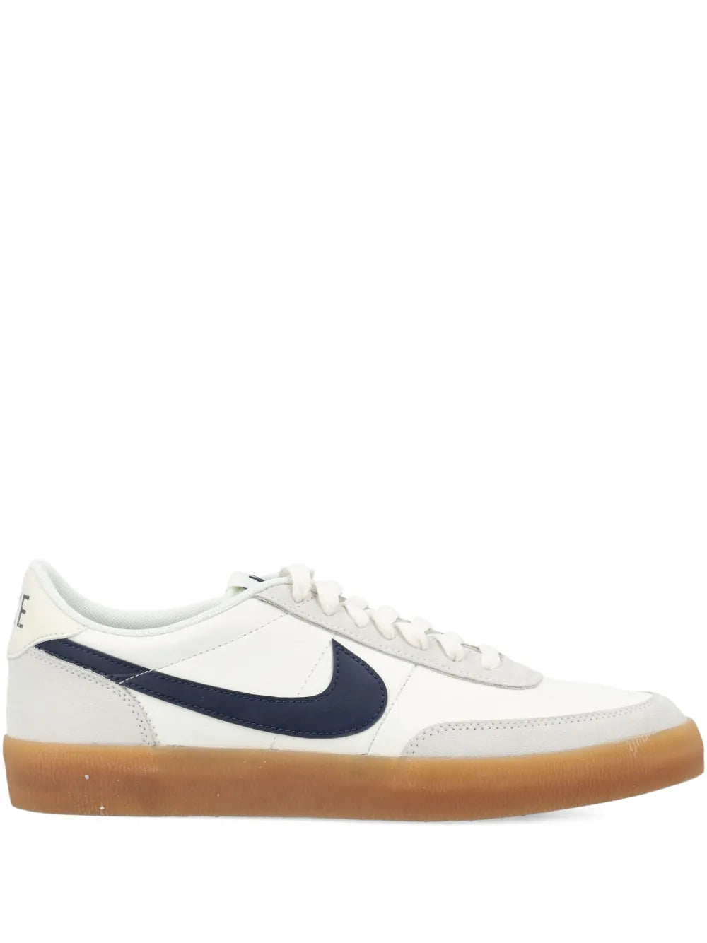 White leather low-top sneaker with navy swoosh and gum sole