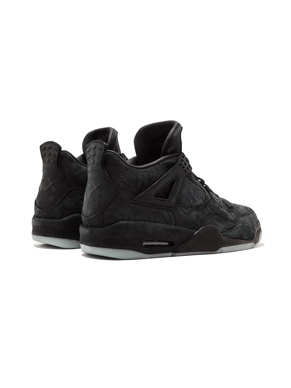 Black Air Jordan 4 retro lace-up mid-top sneakers, rear angle