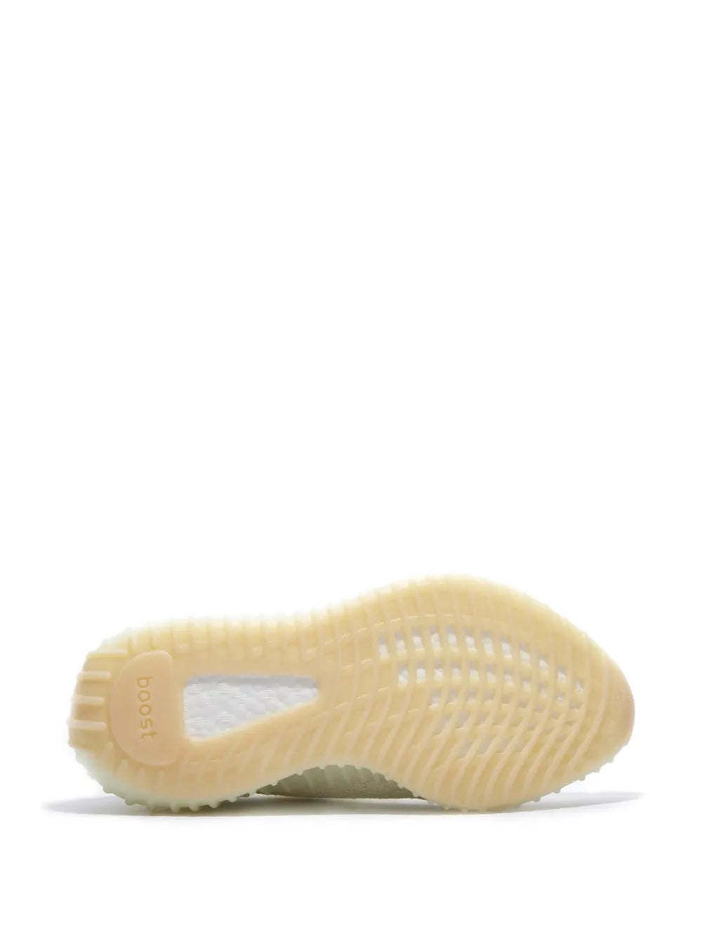 Light cream outsole of knit sneaker with textured tread pattern