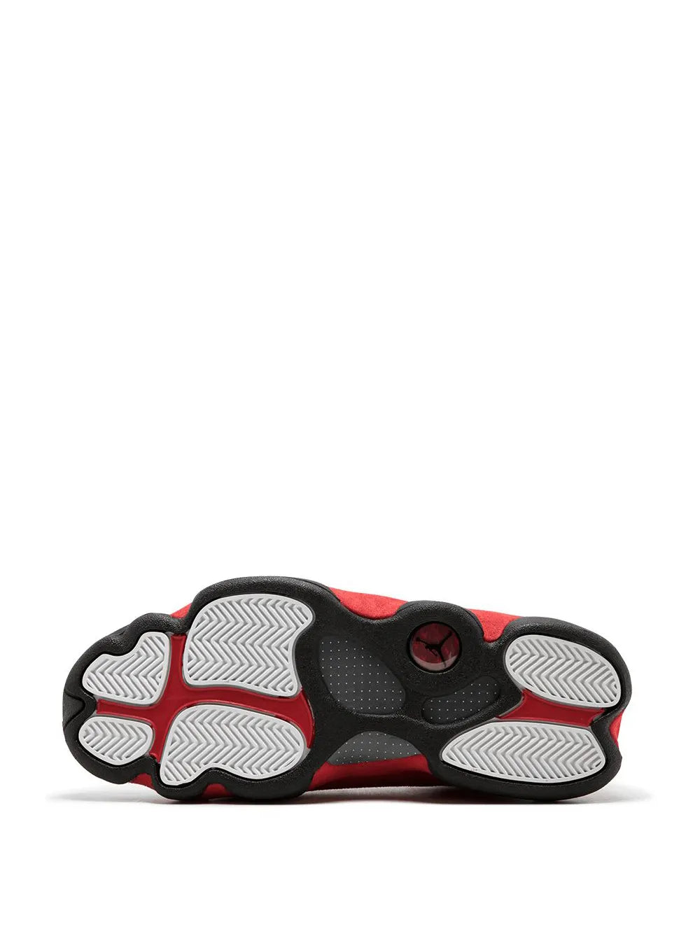 Shoe outsole bottom view with black tread and red side edges