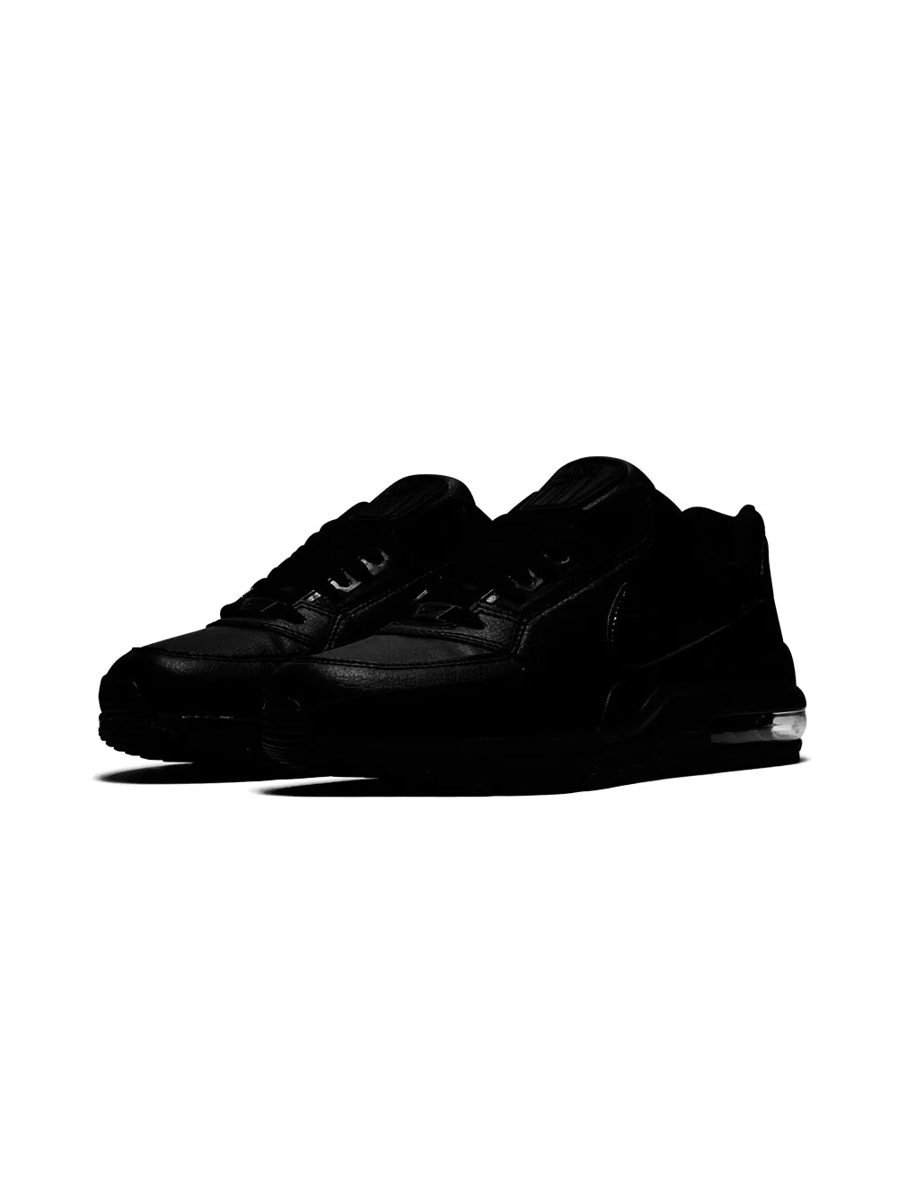 Black low-top lace-up sneakers shown from side, textured upper and Air Max sole.