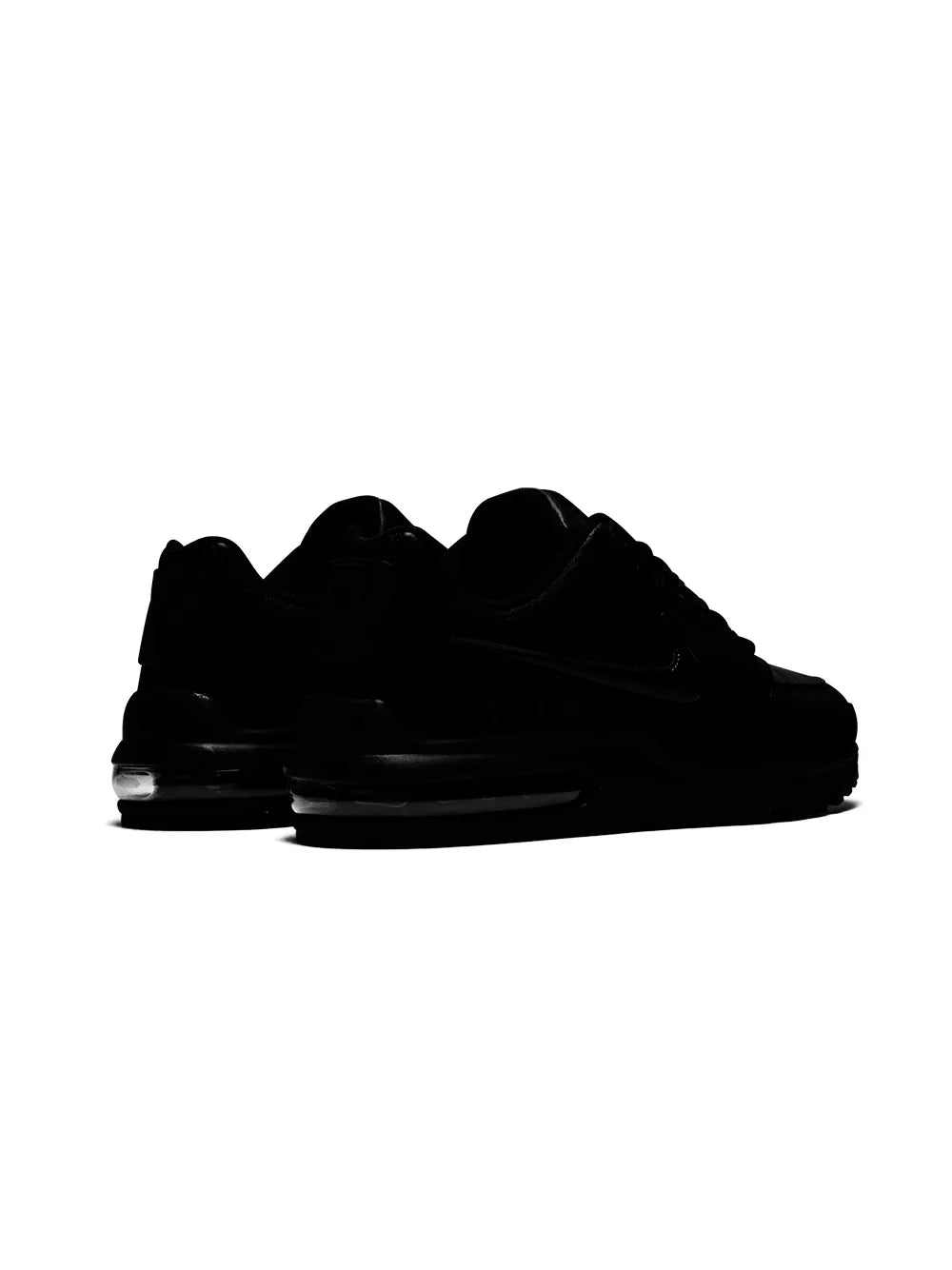 Black low-top lace-up sneakers viewed from back, Air Max midsole and heel details.