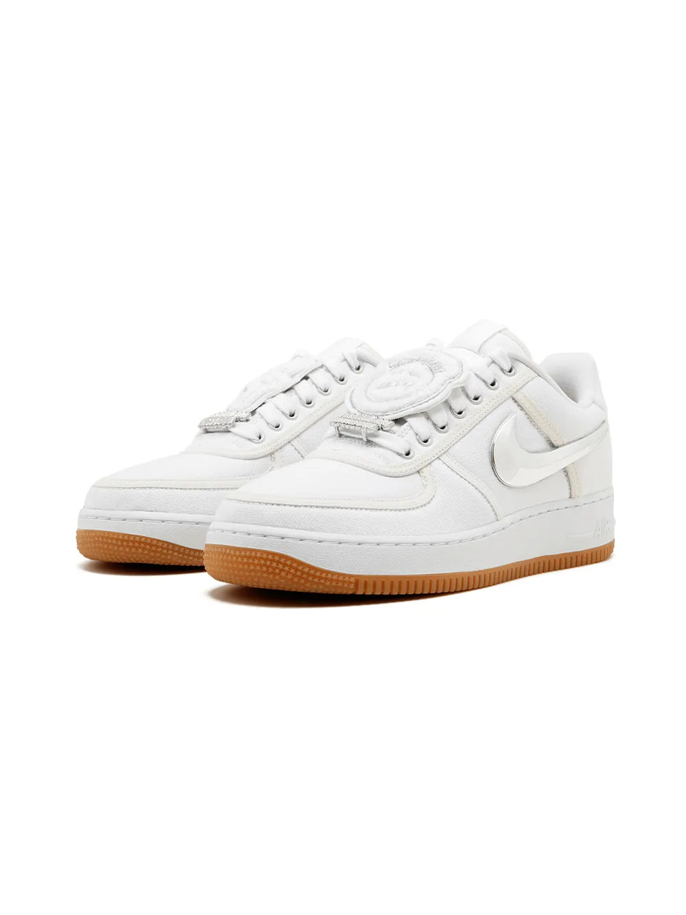White low-top sneaker with lace-up front and gum rubber sole