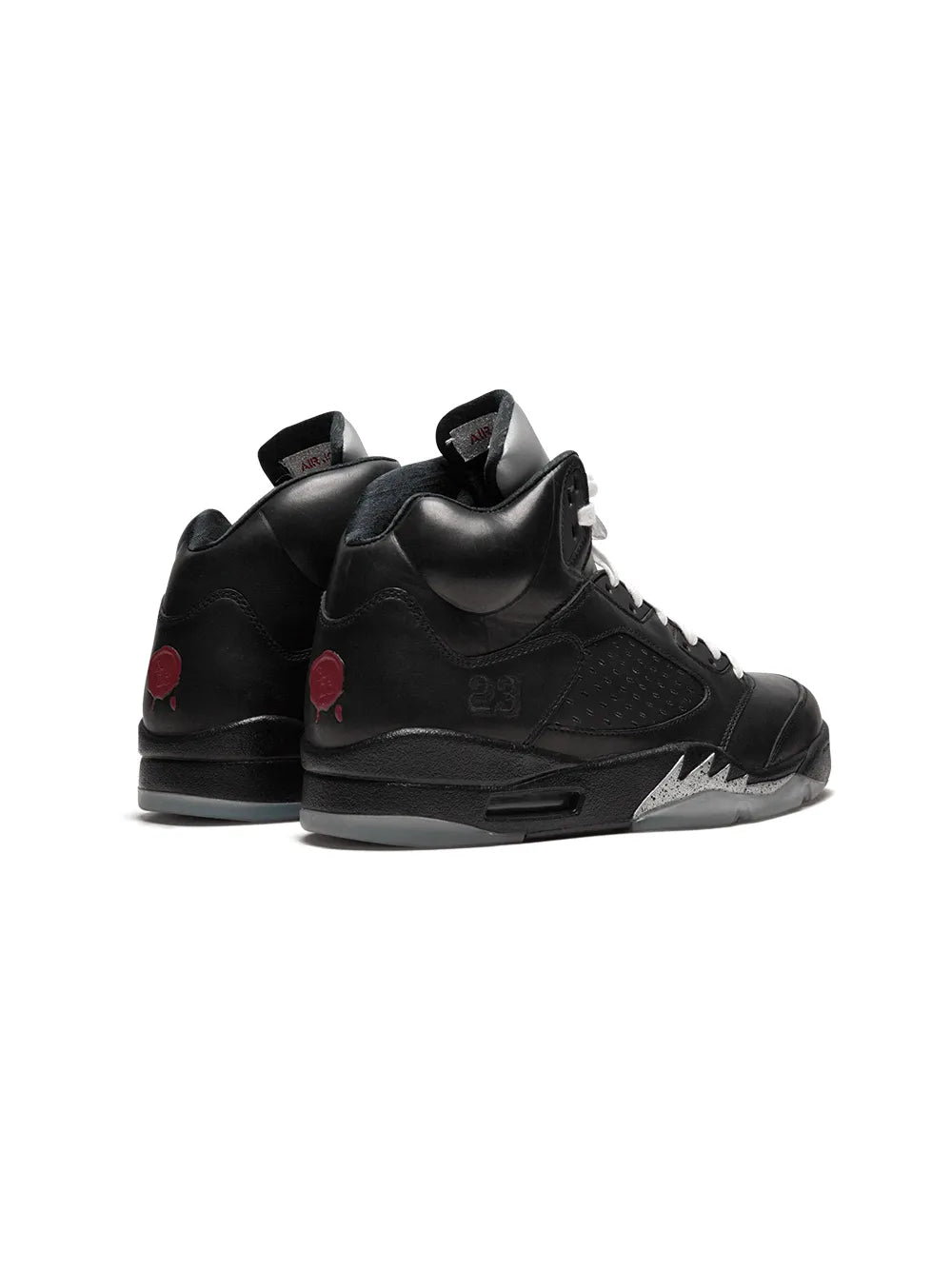 Black high-top sneakers, lace-up design with heel tab and red side details