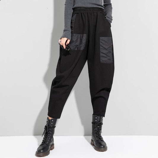 Black cropped loose pants with elastic waistband and cargo patch pockets