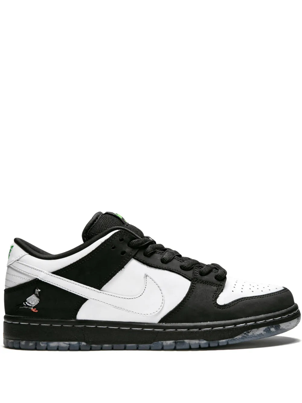 Black and white low-top Nike SB Dunk skate sneakers, green accents
