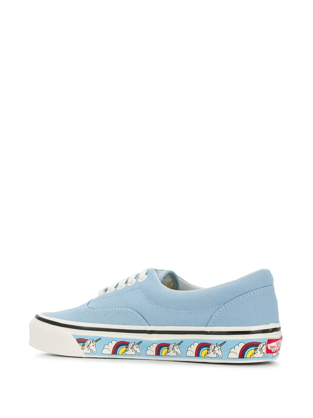 Light blue low-top sneakers with unicorn rainbow heel stripe and black trim