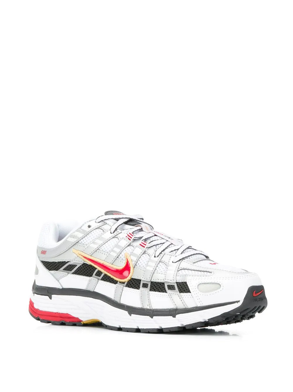 White low-top sneaker with red swoosh, black stripes, chunky sole.