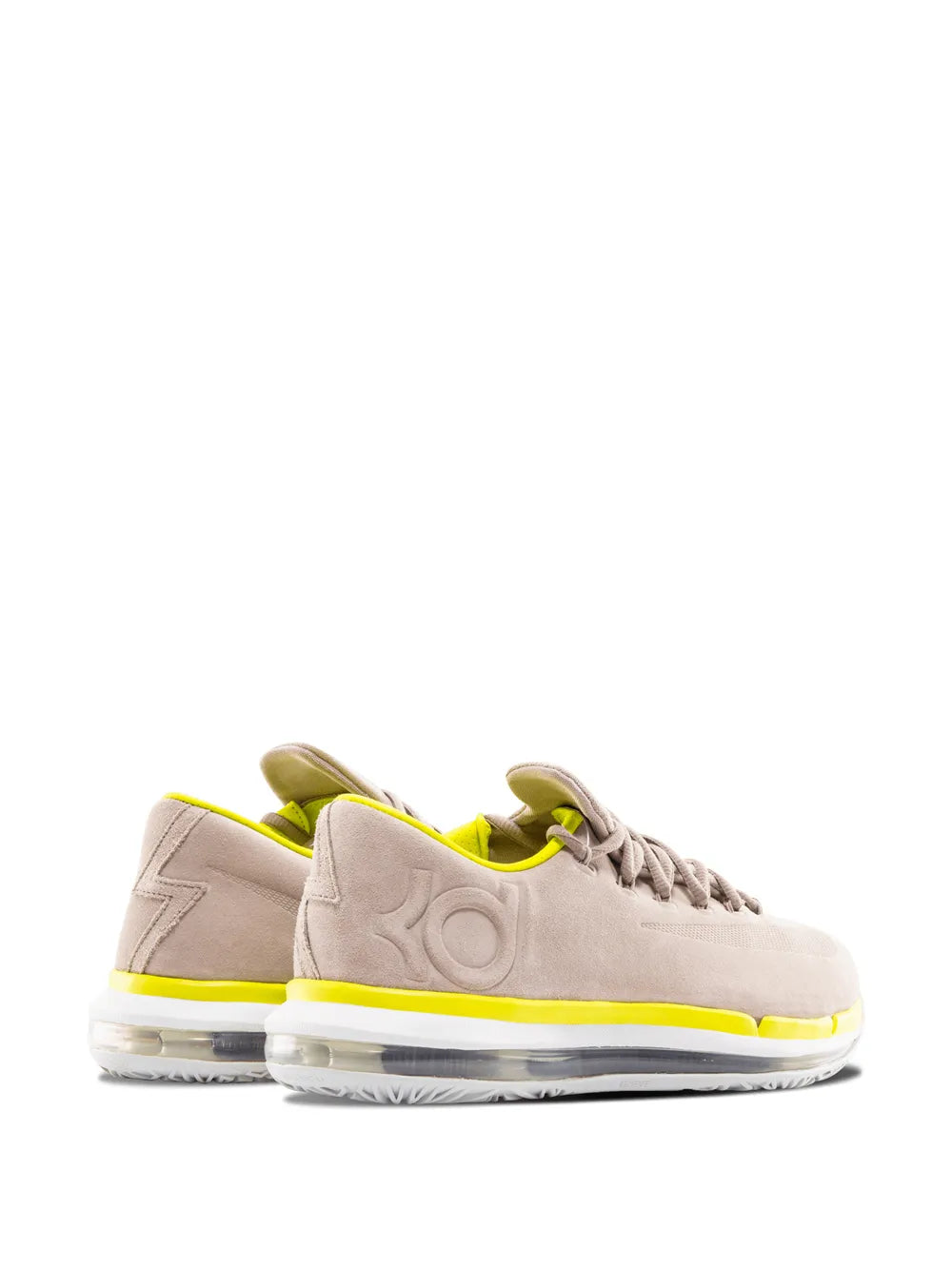 Beige low-top basketball shoe with neon yellow stripe and visible midsole