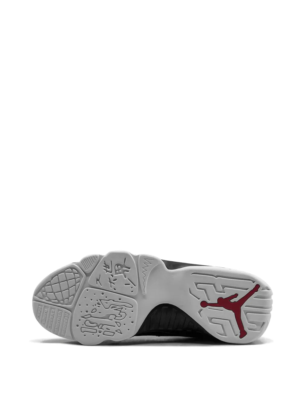 Sneaker outsole with gray traction tread and red Jordan logo marking