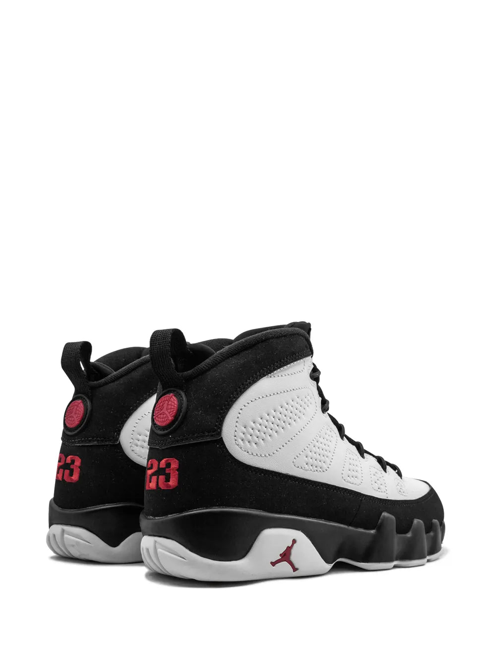 Mid-top sneakers with black collar, white side panels, and red "23" patches