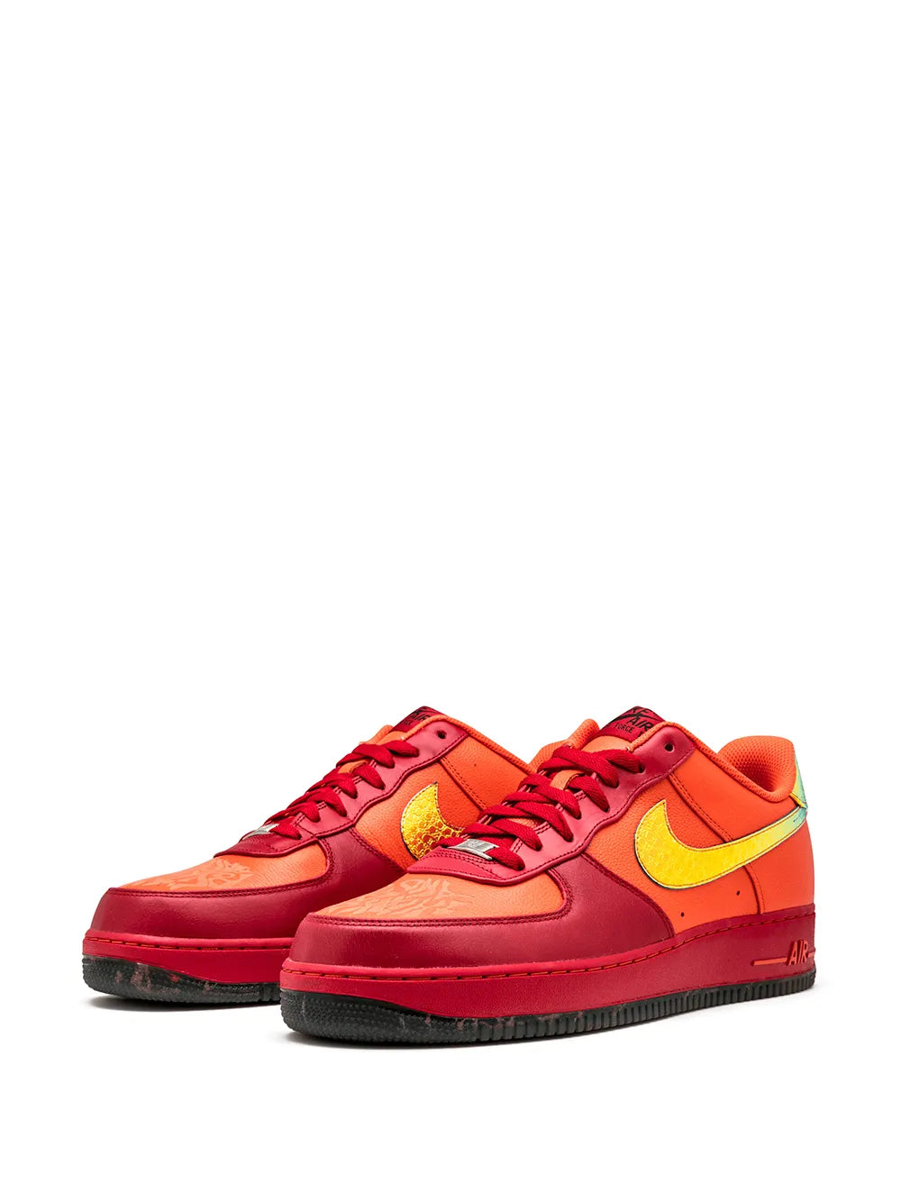 Nike Air Force 1 low-top sneakers pair in red/orange with yellow swoosh and red laces