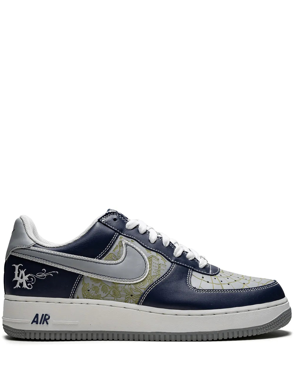 Nike Air Force 1 sneaker in navy with tan panels and white laces