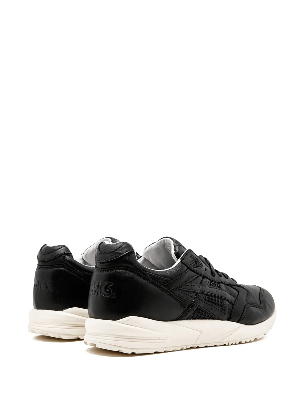 Black low-top sneaker heel view with padded collar and white midsole