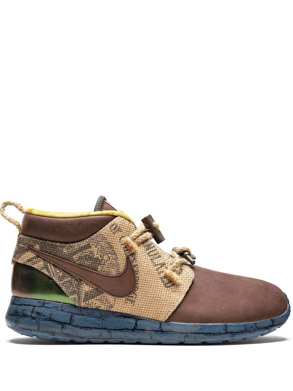 Nike Roshe Run sneaker with brown suede upper, beige patterned strap, blue sole