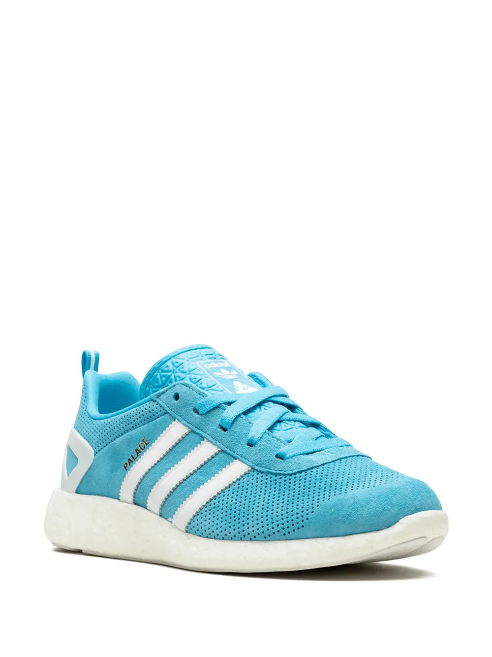 Blue low-top sneaker side view with white stripes and teal lace-up