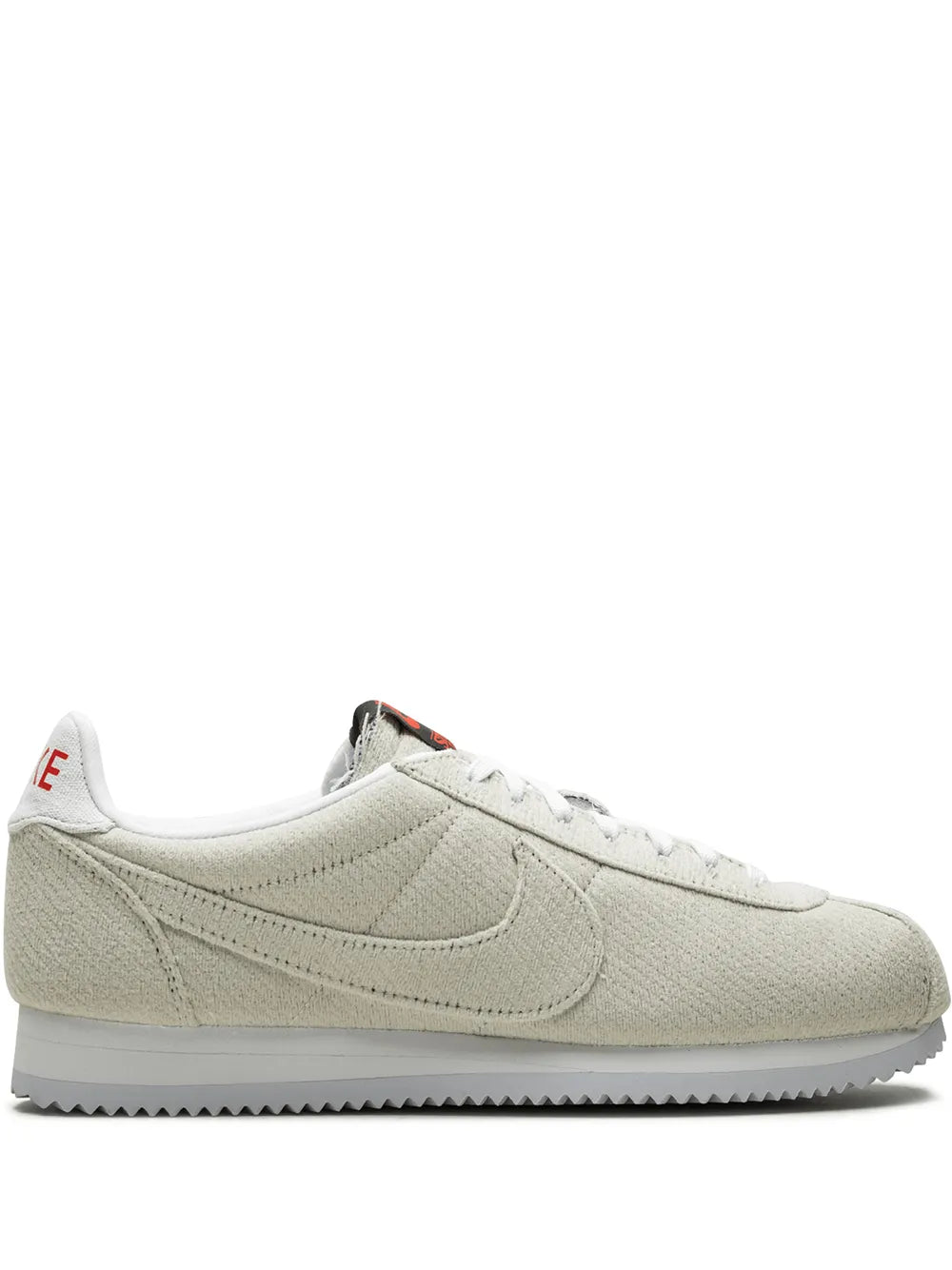 Tan low-top Nike Cortez QS sneaker with white laces and side swoosh