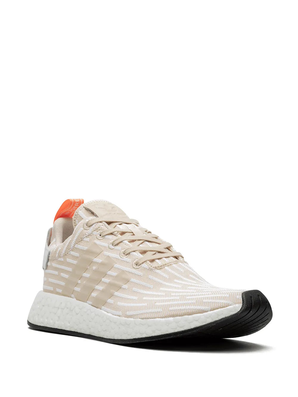 Beige knit sneaker with orange pull tab and textured rubber midsole