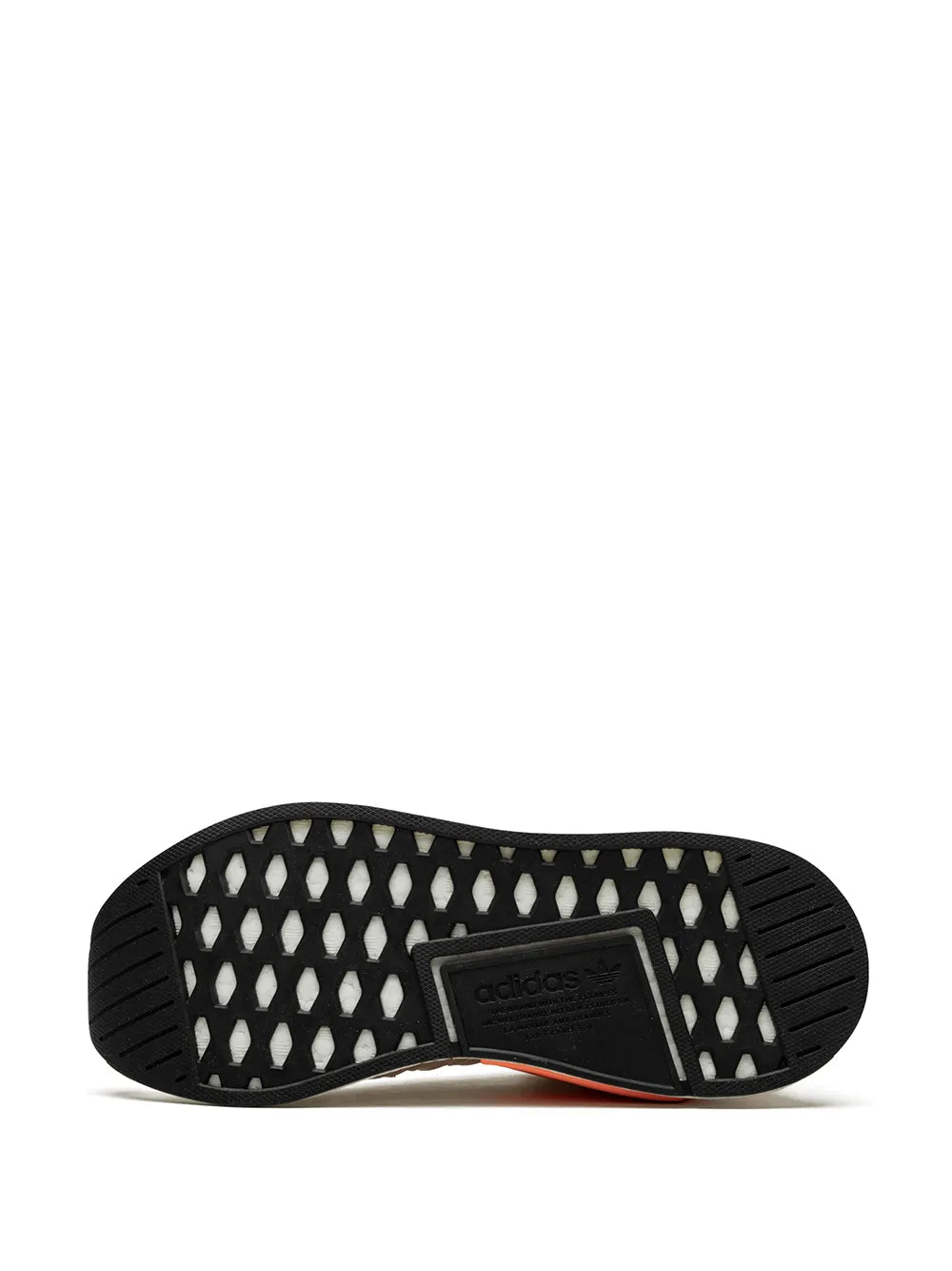 Black rubber outsole with tread and adidas logo on heel, beige upper edge visible