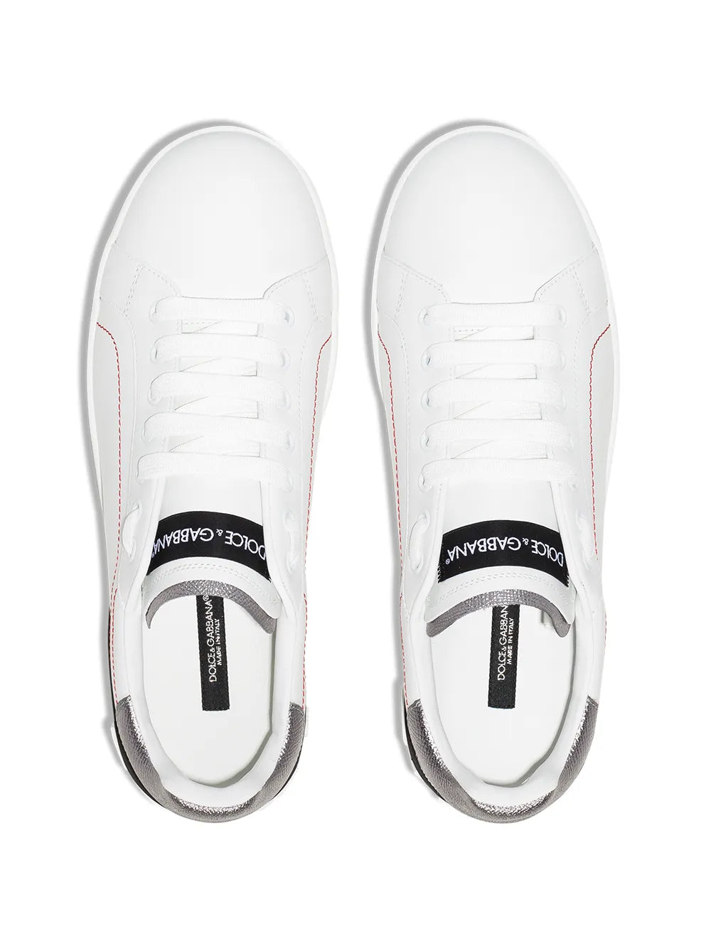 Pair of white leather sneakers with white laces and gray metallic heel