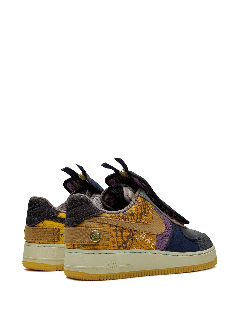 Pair of low-top sneakers with black strap, gold Swoosh, orange print and blue/purple panels