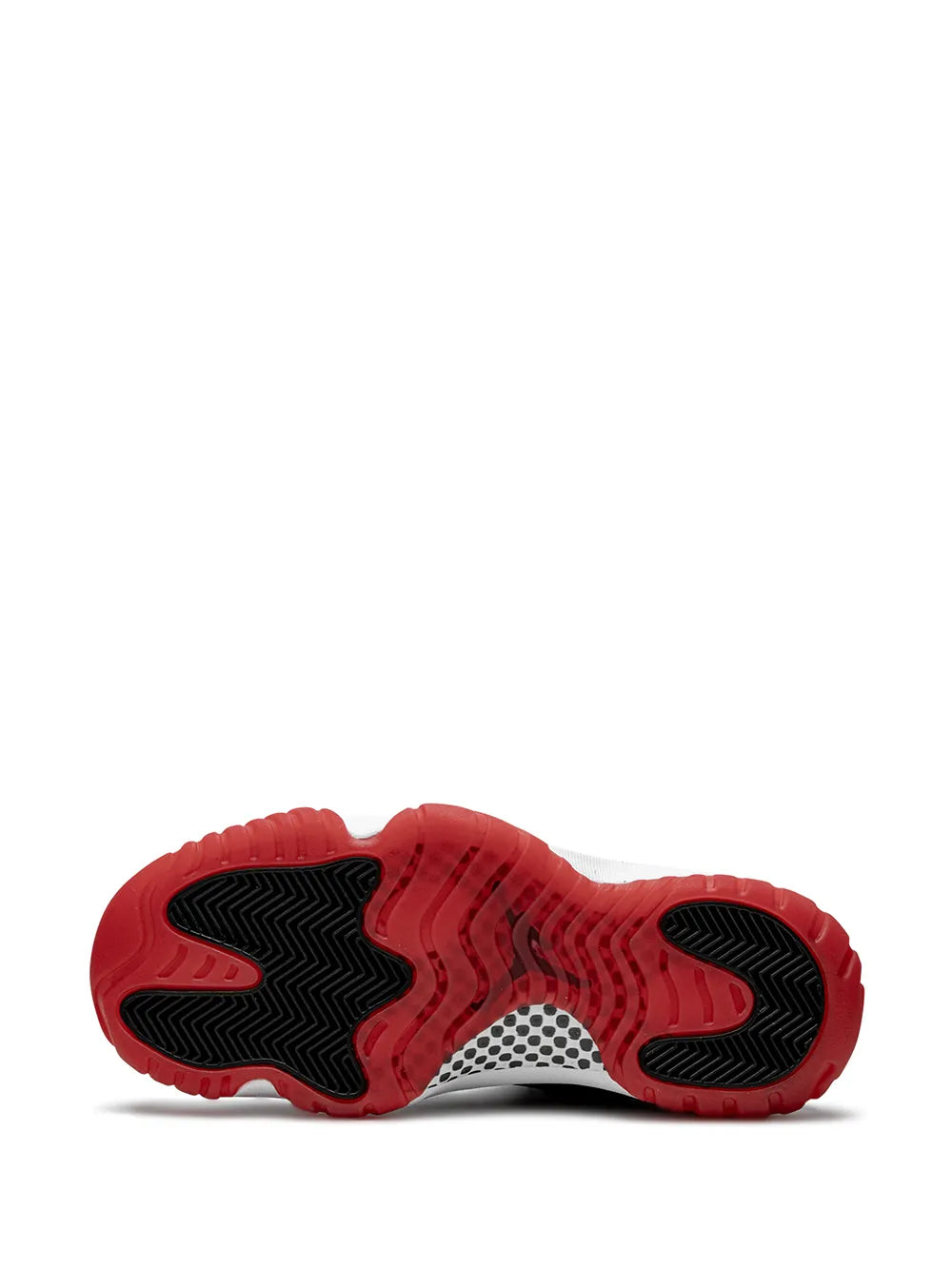 Black rubber outsole with red traction pattern under high-top sneaker
