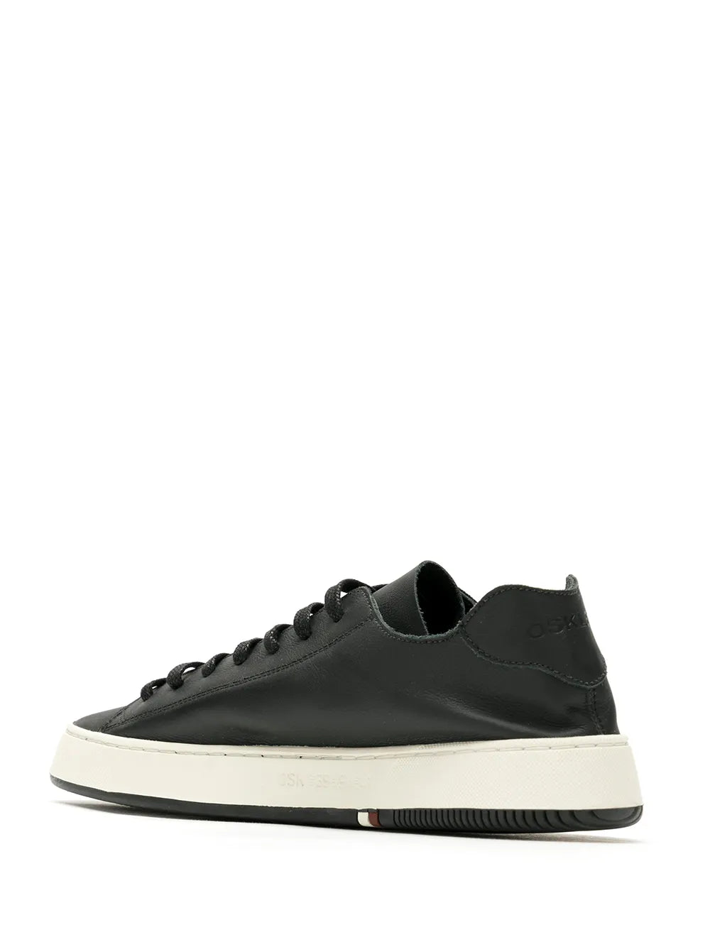 Black low-top sneakers, side view, with lace-up closure and white midsole