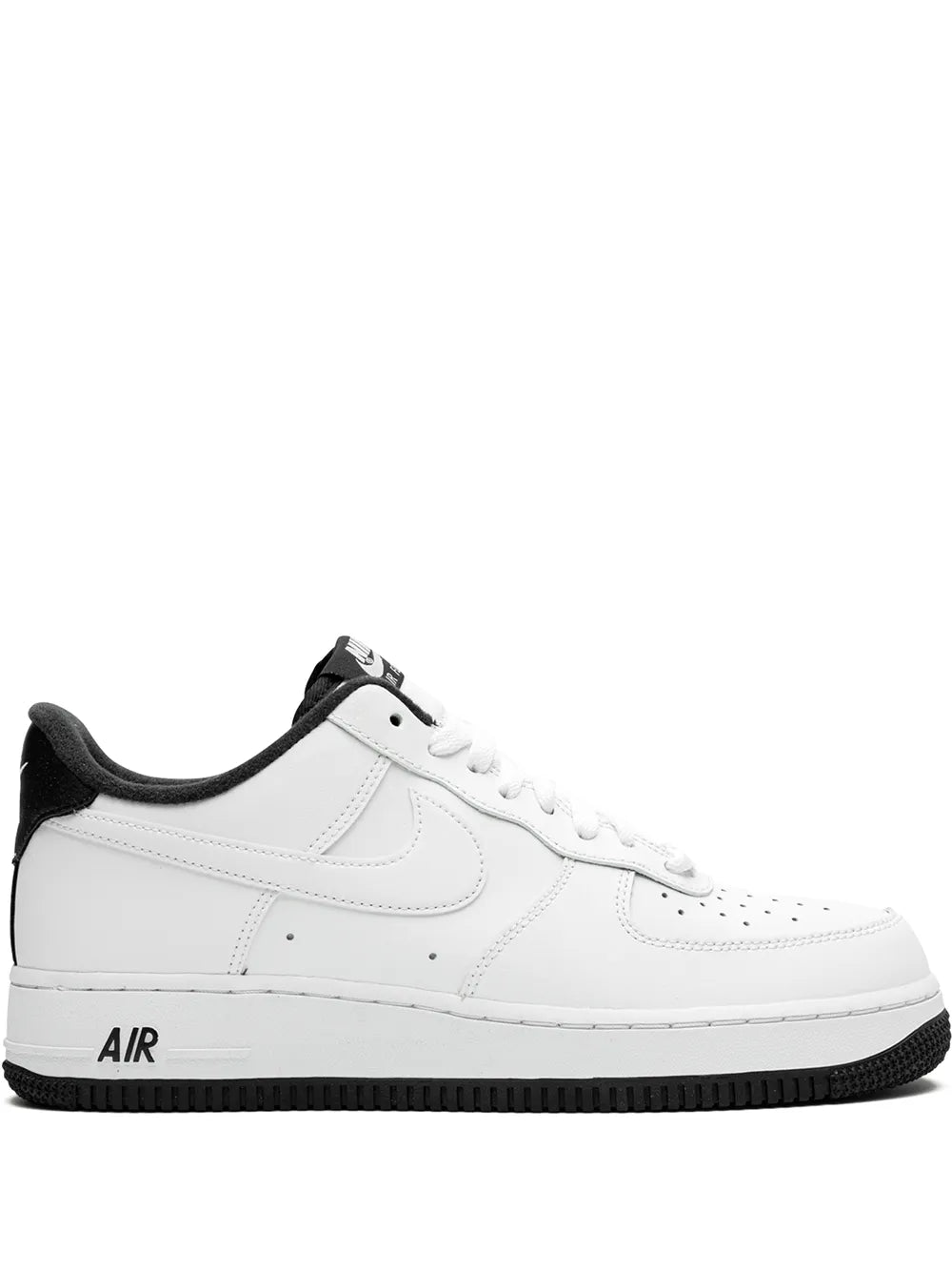 White leather low-top sneakers with black accents, swoosh logo, and 'AIR' on midsole