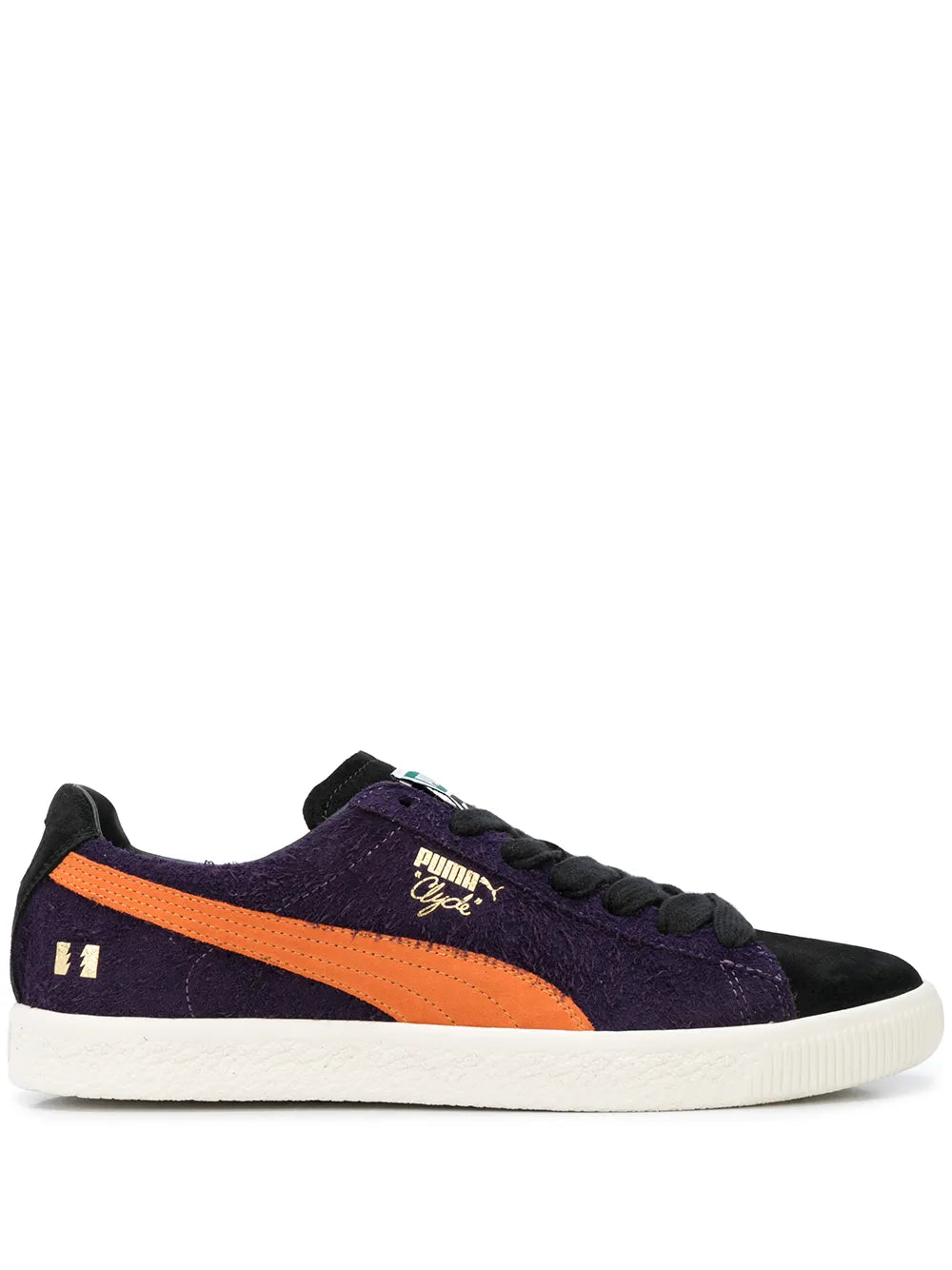 PUMA low-top sneakers in dark purple with orange side stripe and white rubber sole