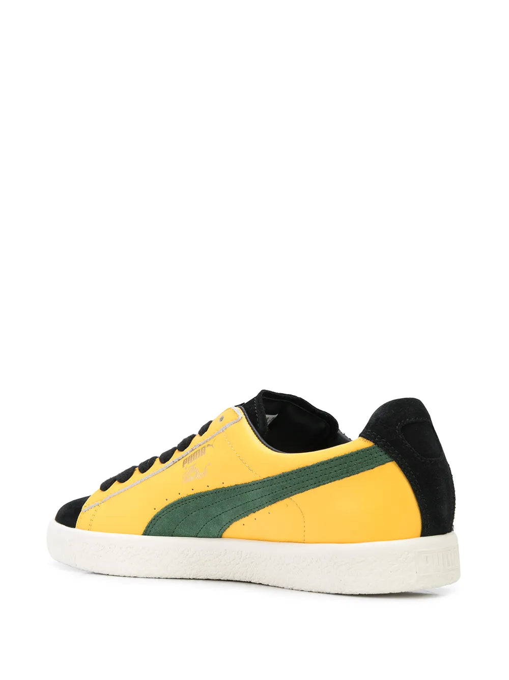 PUMA low-top sneakers with yellow upper, green side stripe, black heel, white sole