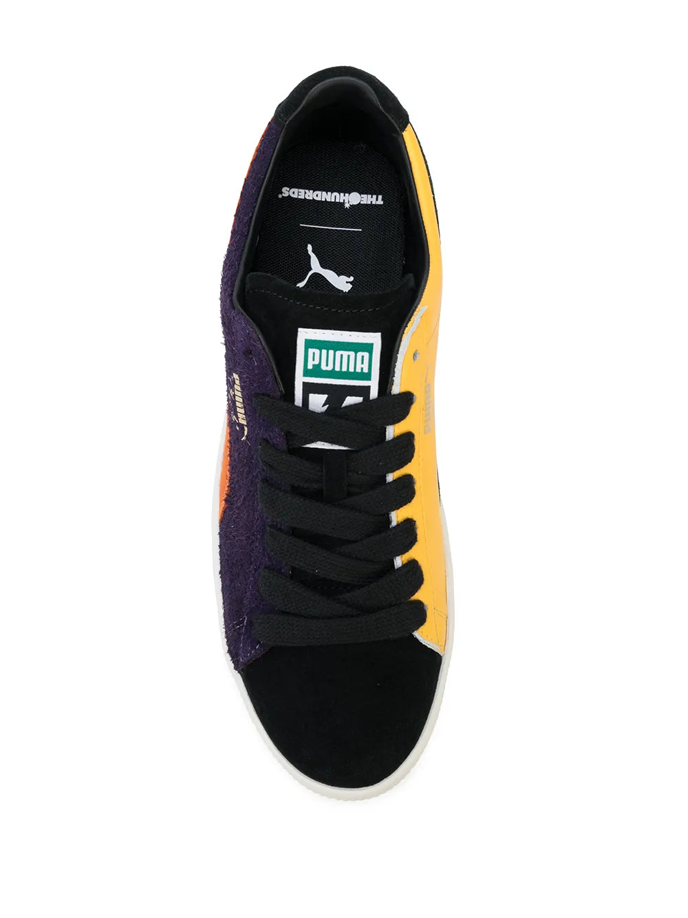 PUMA low-top sneakers with purple upper, black laces, yellow side panel, white sole