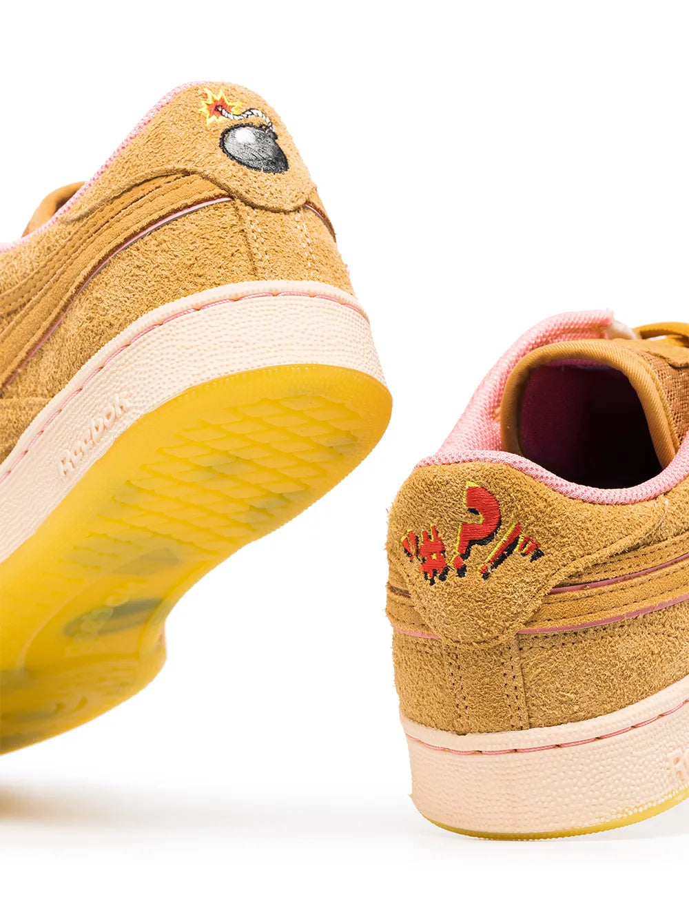 Tan suede sneakers close-up, pink lining and yellow outsole with lace panel