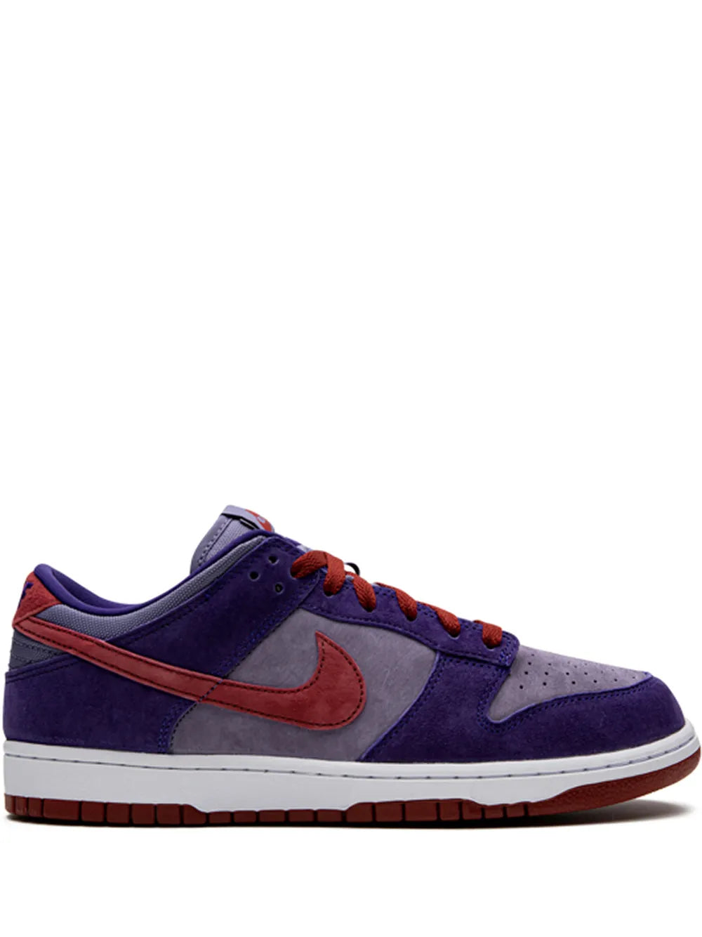 Purple low-top sneakers with orange Nike swoosh, red laces, and white midsole