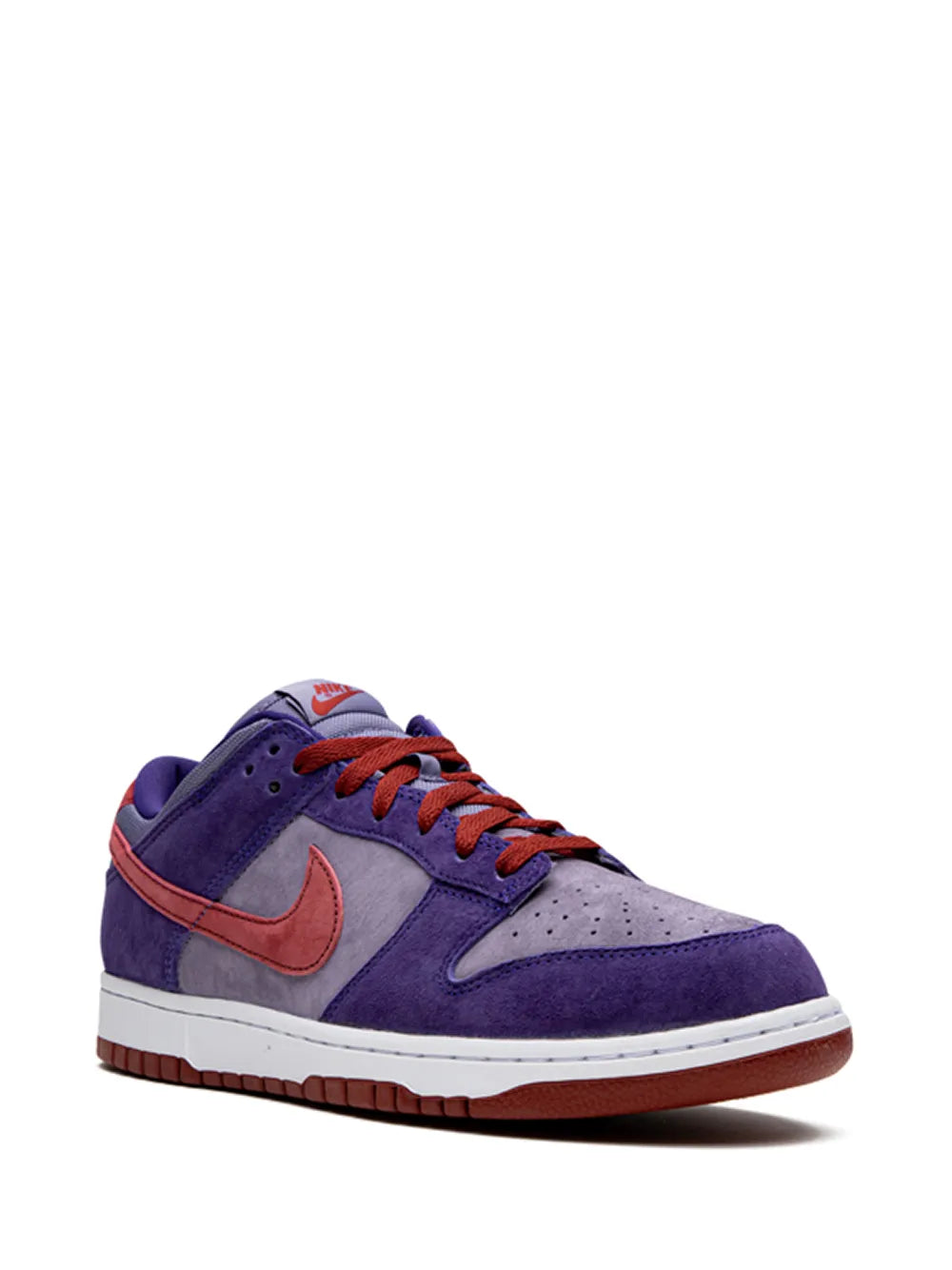 Purple suede low-top sneakers with gray panels, orange Nike swoosh, and red laces
