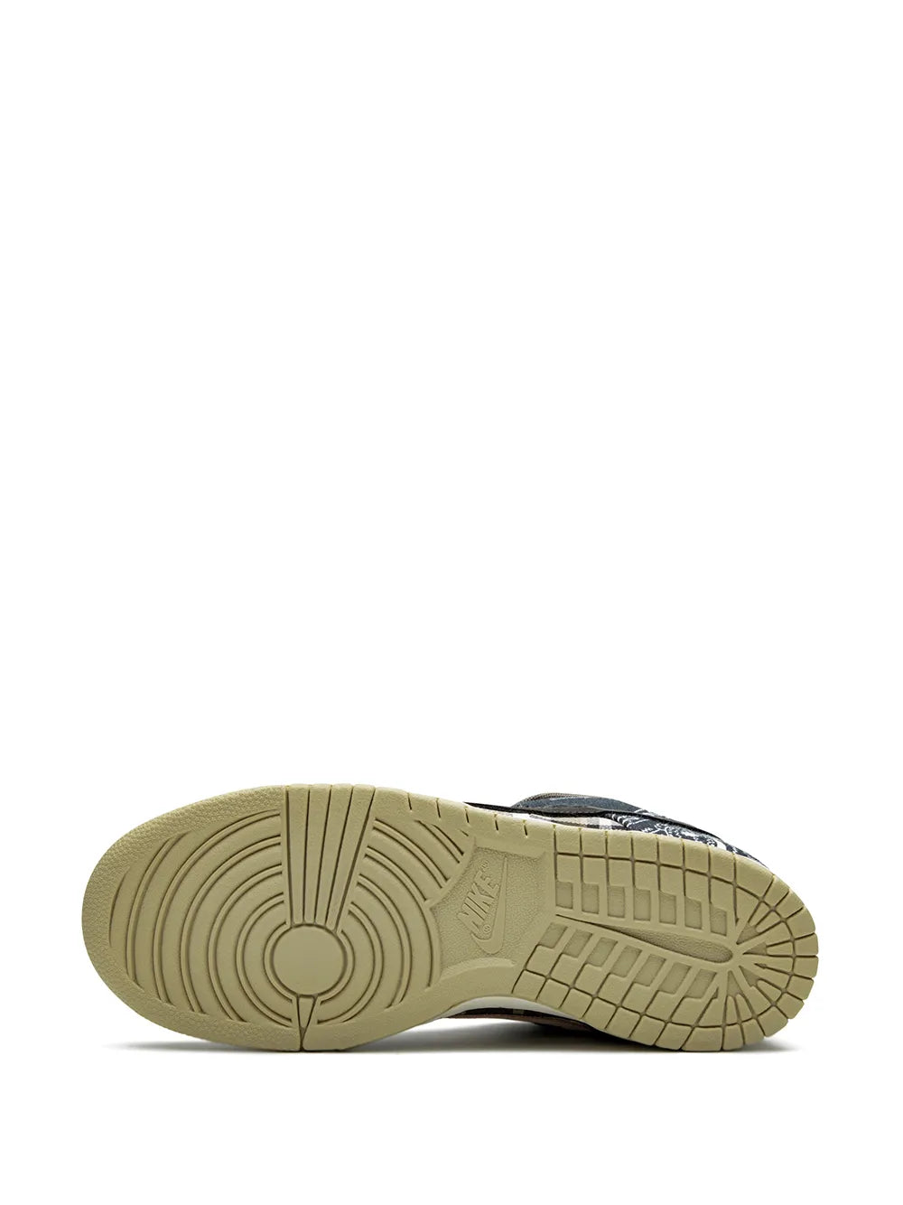 Nike SB Dunk Low QS outsole view with textured rubber traction in beige