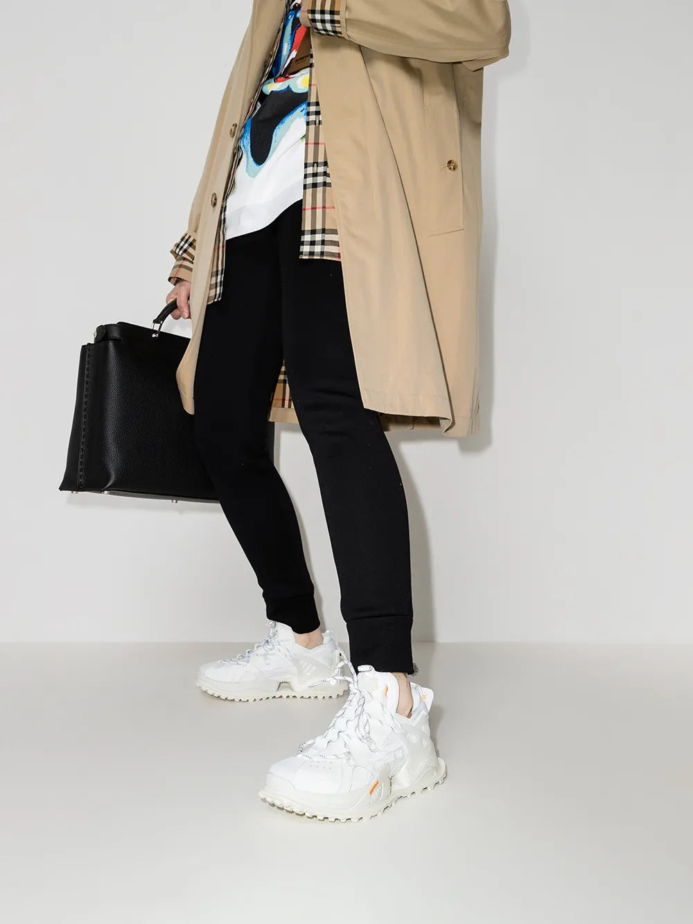 White low-top sneakers with chunky tread outsole