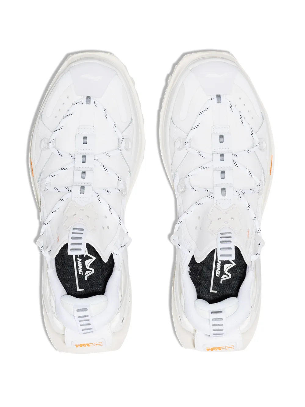 White sneaker pair top view showing lace eyelets and thick sole