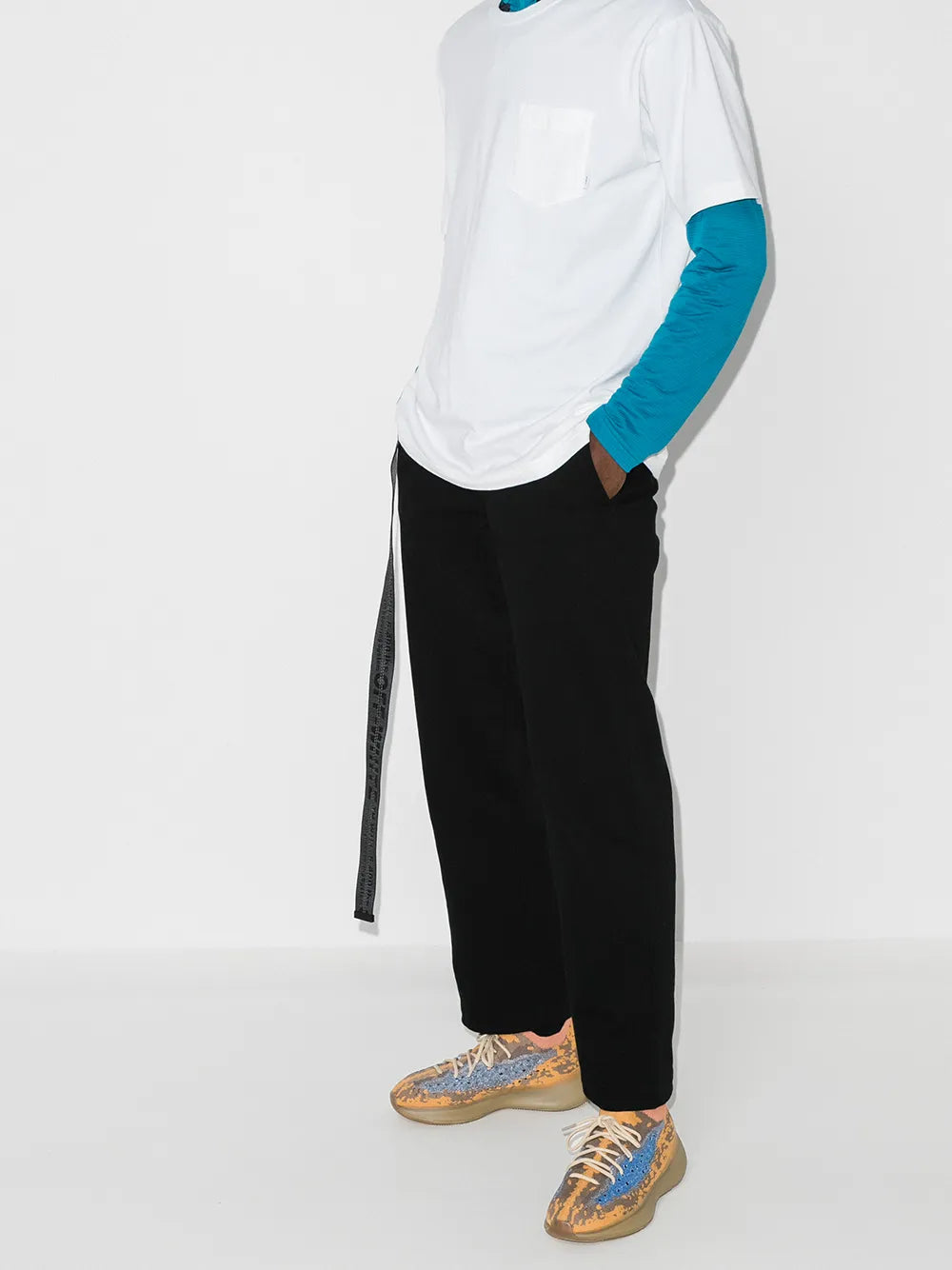 adidas Yeezy Boost 380 sneakers on feet, orange and blue knit lace-up