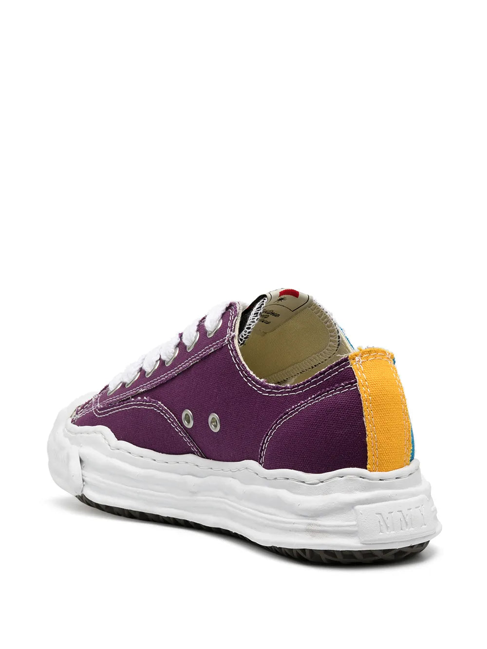Purple low-top sneaker with yellow side patch and white laces